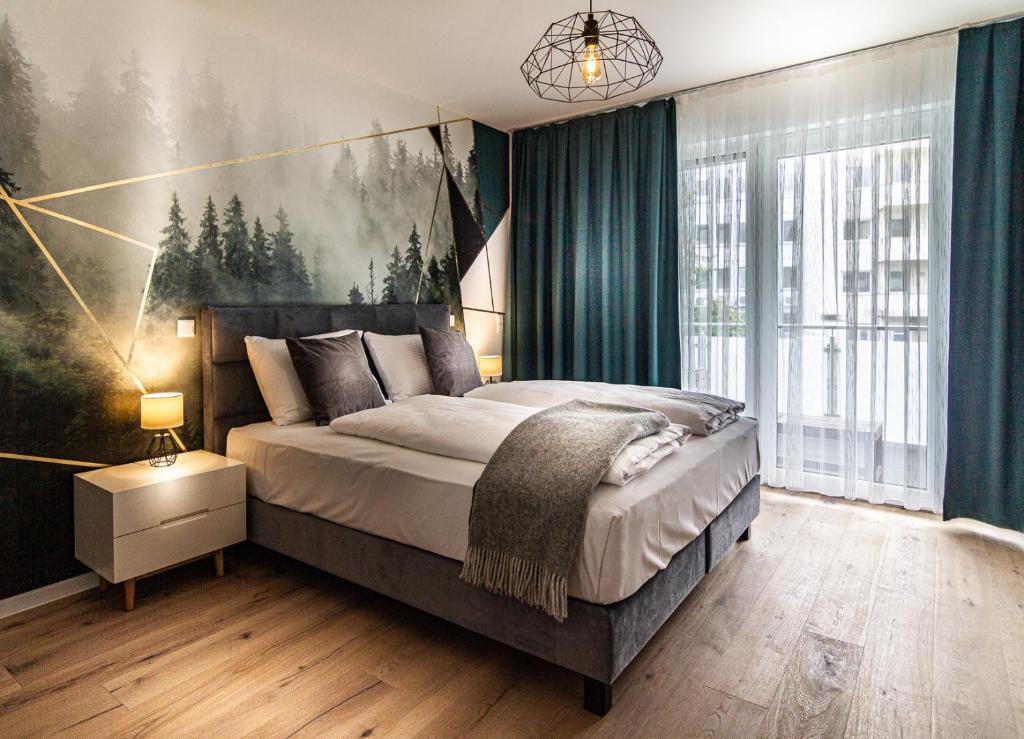 Säng eller sängar i ett rum på Sleep Inn Düsseldorf Suites