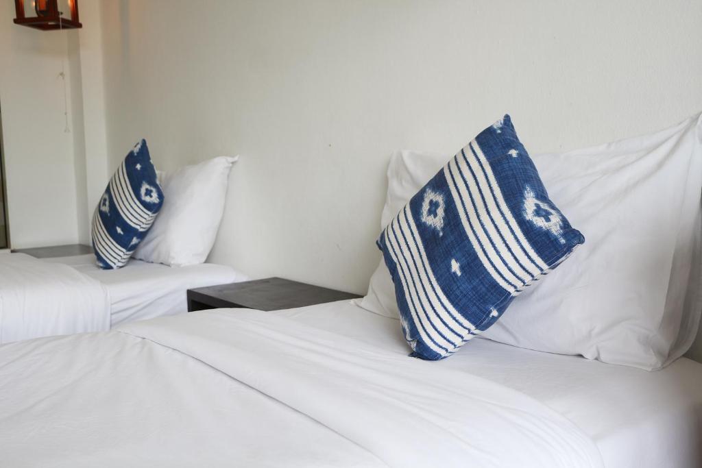 Postel nebo postele na pokoji v ubytování The Nest Resort Patong