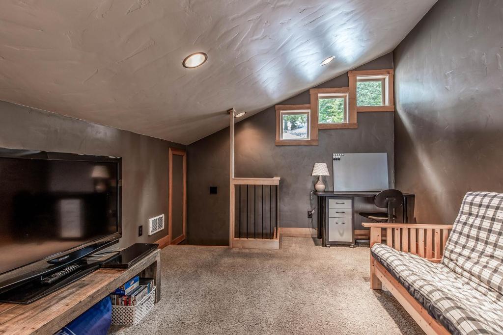 a living room with a flat screen tv and a couch at 3 Bed 3 Bath Vacation home in Schweitzer Mountain in Sandpoint