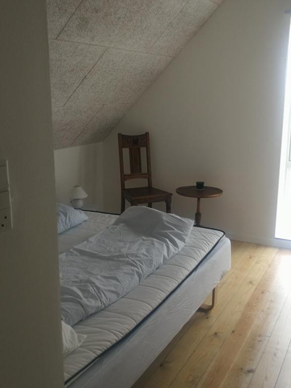 Postel nebo postele na pokoji v ubytování Bønnerup Strand