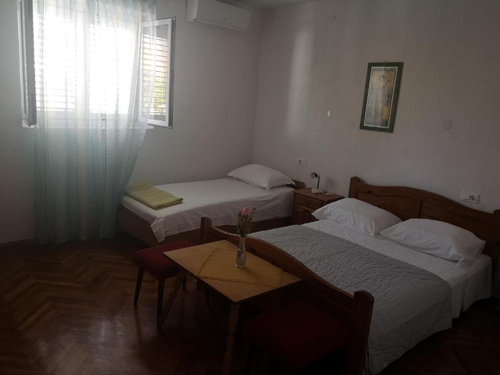 Postel nebo postele na pokoji v ubytování Apartmani Sea