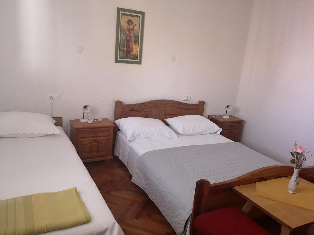 Postel nebo postele na pokoji v ubytování Apartmani Sea