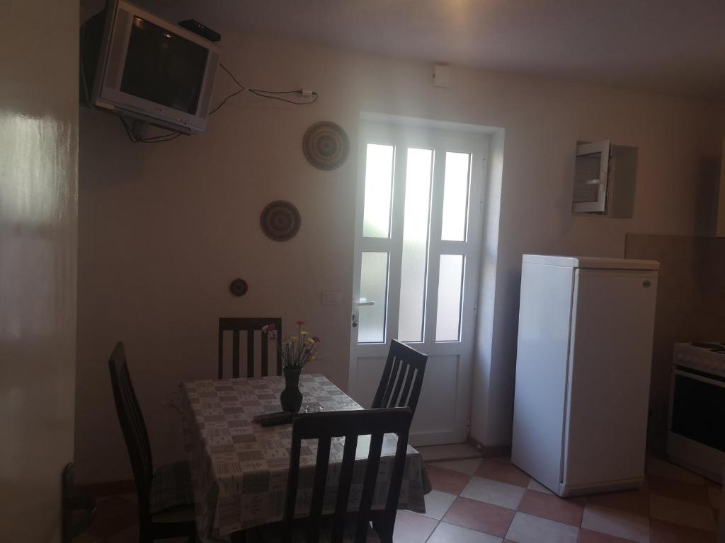 Kuchyň nebo kuchyňský kout v ubytování Apartmani Sea