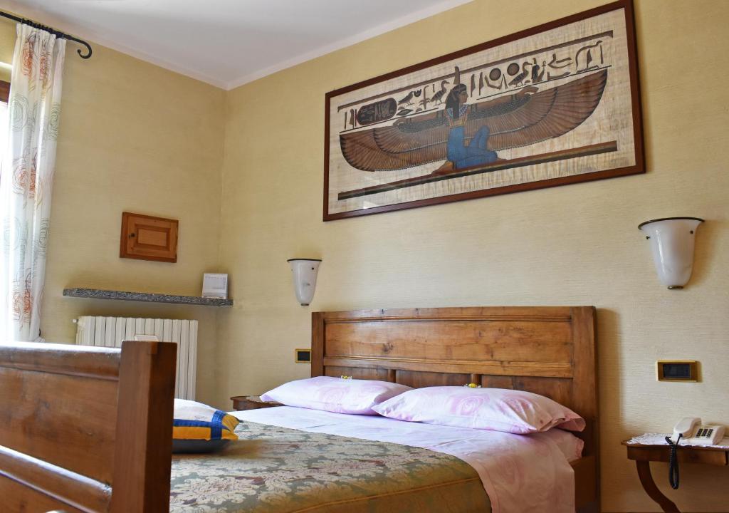 Posteľ alebo postele v izbe v ubytovaní Albergo Ristorante Conca Azzurra