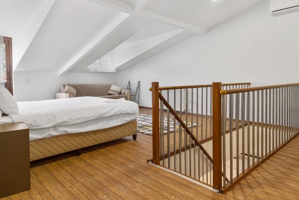 Postel nebo postele na pokoji v ubytování Modern Suites