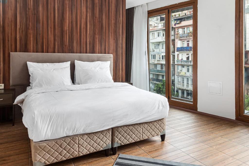 Postel nebo postele na pokoji v ubytování Modern Suites