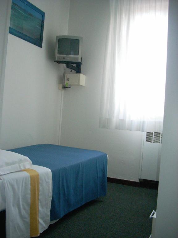 Postel nebo postele na pokoji v ubytování Hotel Tuscolano