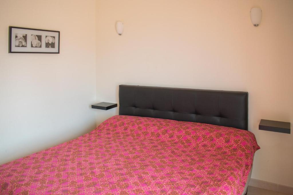 A bed or beds in a room at Lajas De Chapin FREE WIFI