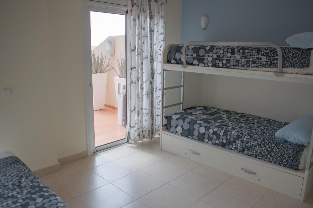 A bed or beds in a room at Lajas De Chapin FREE WIFI