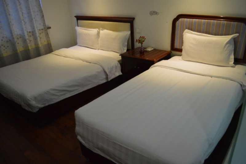 Postel nebo postele na pokoji v ubytování Xi'an The Facebook Youth Hostel
