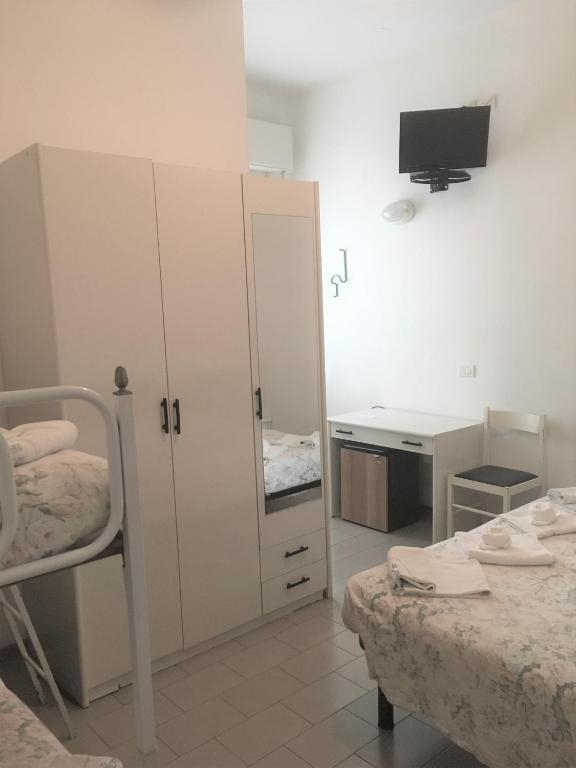 Postel nebo postele na pokoji v ubytování Hotel Floreale