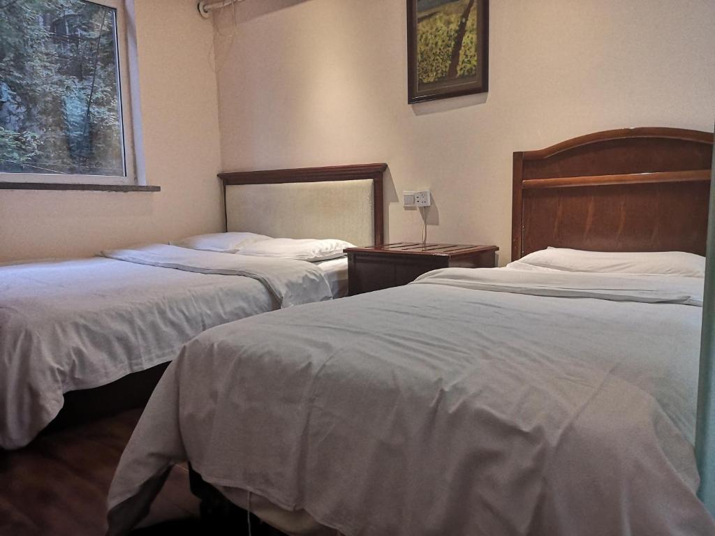 Postel nebo postele na pokoji v ubytování Xi'an The Facebook Youth Hostel