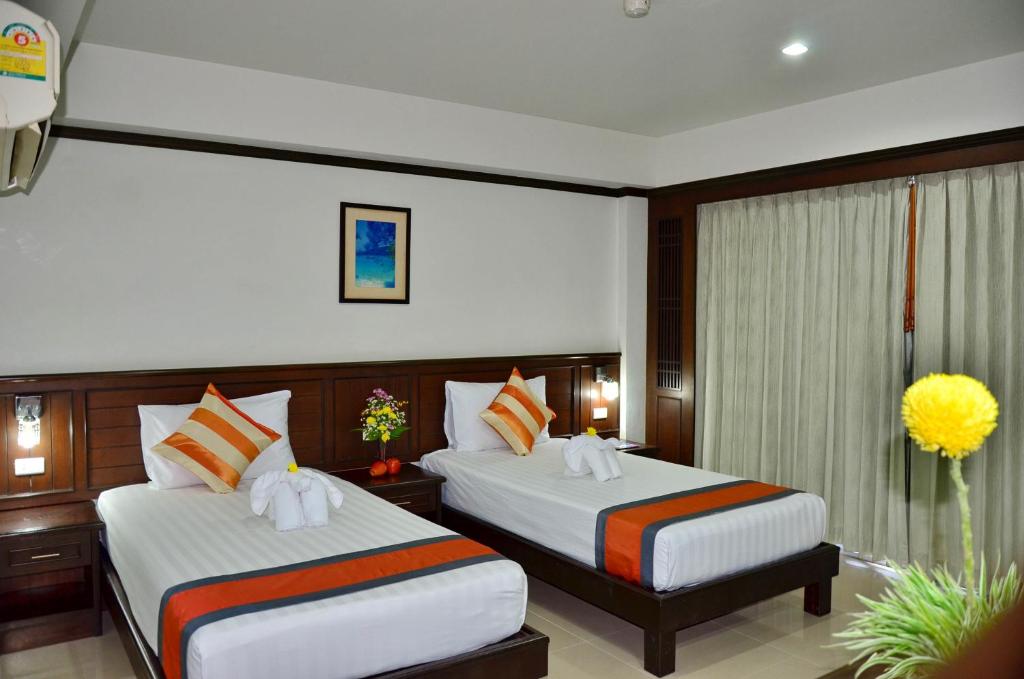Postel nebo postele na pokoji v ubytování First Residence Hotel