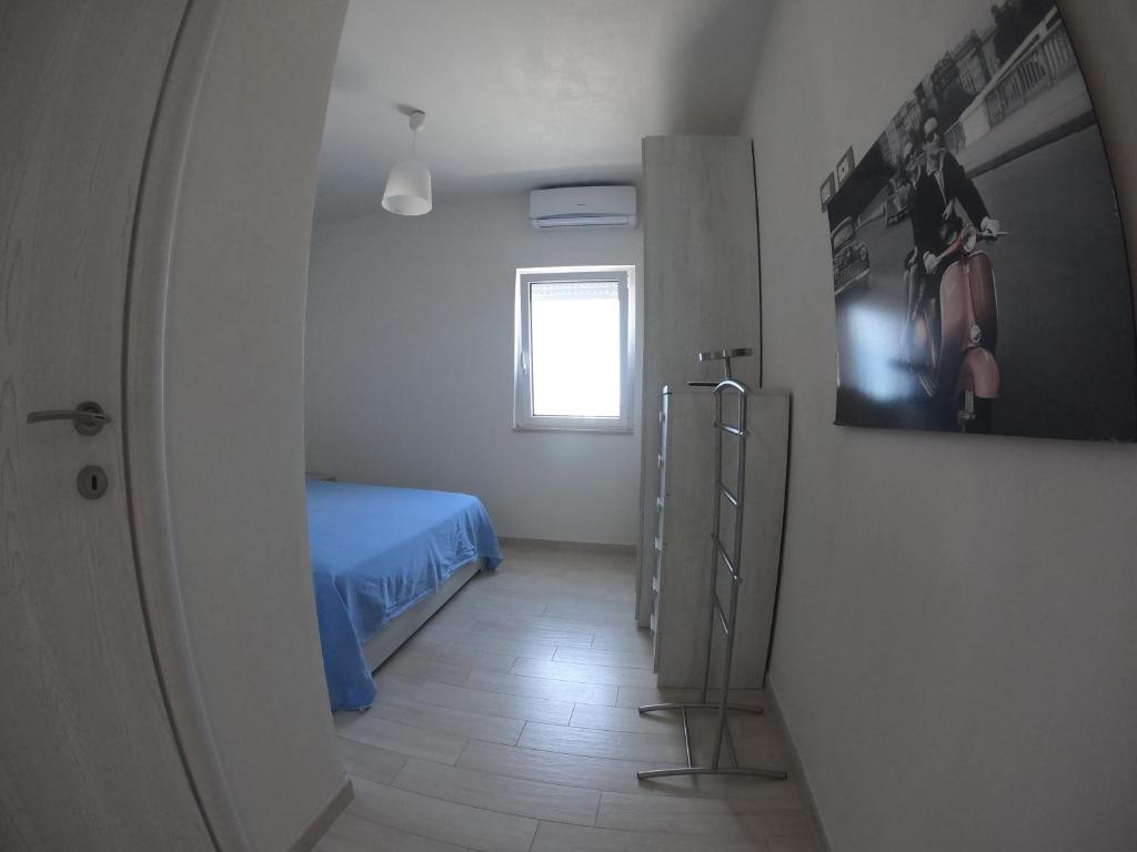 Postel nebo postele na pokoji v ubytování Casa Profumi di Puglia