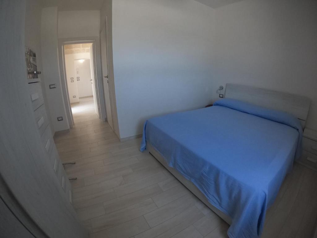 Postel nebo postele na pokoji v ubytování Casa Profumi di Puglia