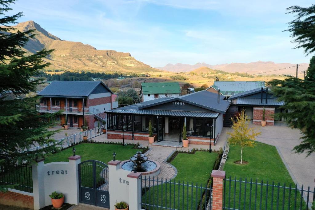 an aerial view of a house with a fountain at Clarens Retreat in Clarens
