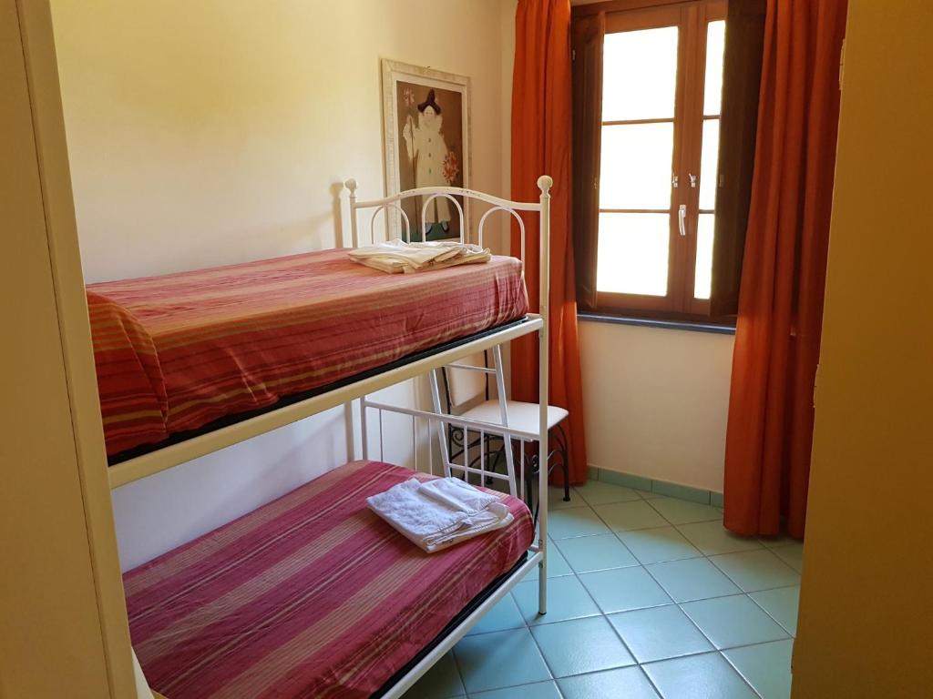 Posteľ alebo postele v izbe v ubytovaní Villaggio Turistico Airone