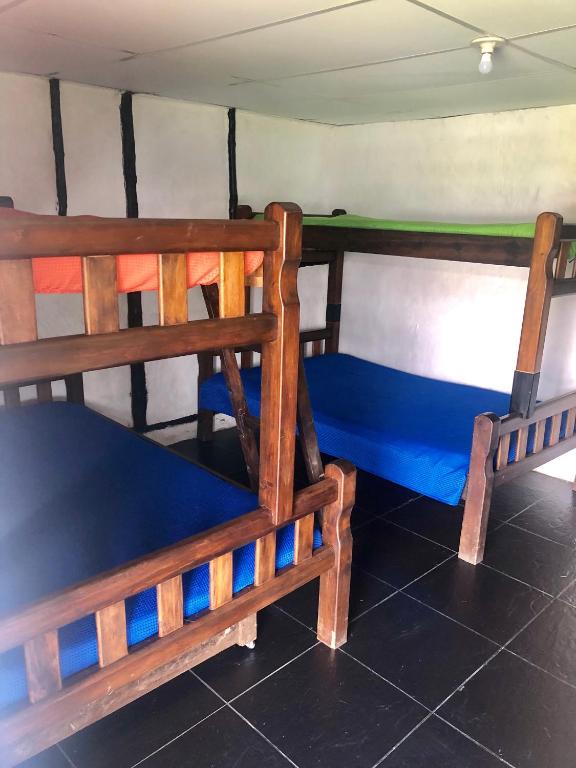 Postel nebo postele na pokoji v ubytování Finca Hotel Paraiso Urrao