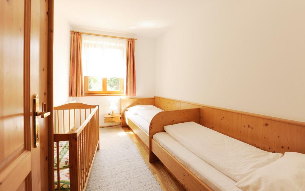 Postel nebo postele na pokoji v ubytování Winzerhof - Gästehaus Stöger