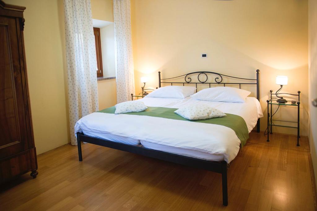 Postel nebo postele na pokoji v ubytování Guesthouse Muha