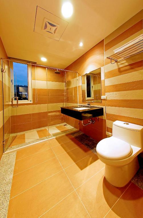 a bathroom with a toilet and a sink at Sun Moon Lake Karuizawa Villa in Yuchi