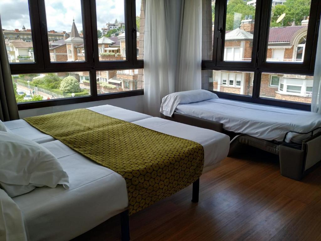 Postel nebo postele na pokoji v ubytování Hotel Ezeiza