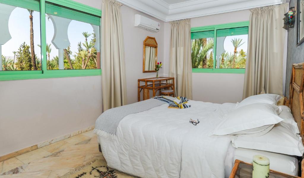 Postel nebo postele na pokoji v ubytování In Club Palmeraie Resorts