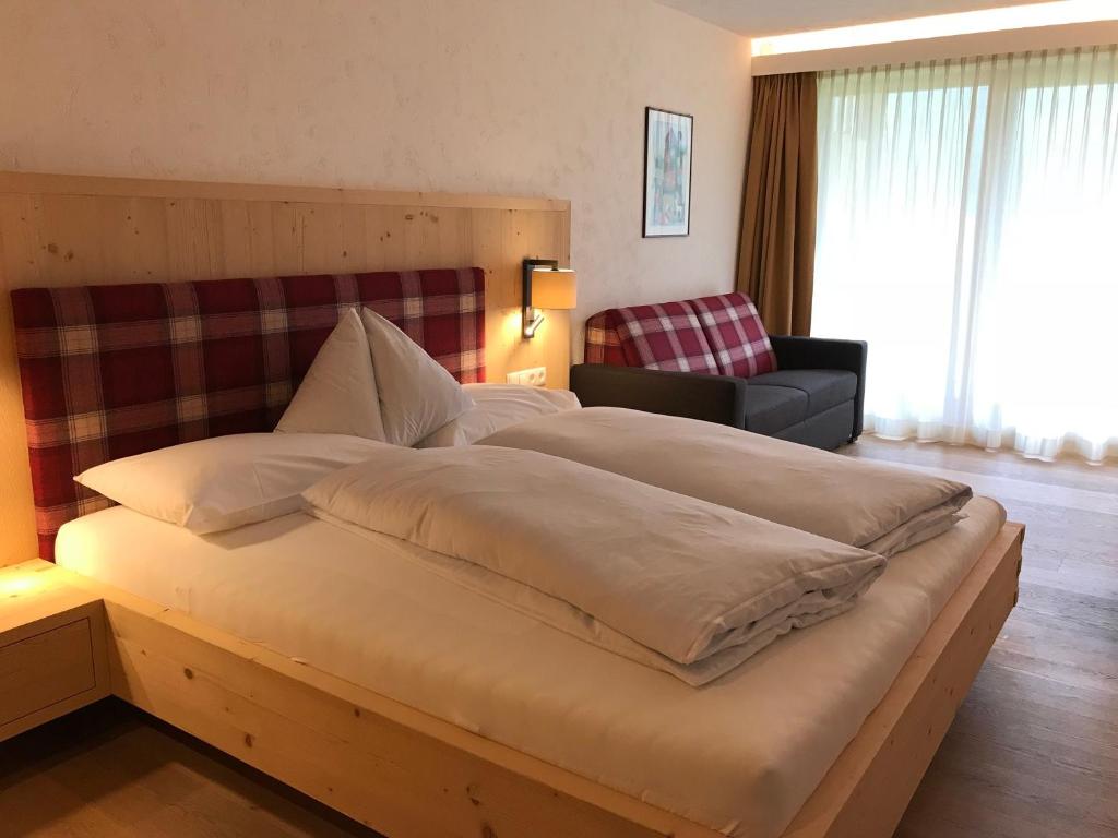 Postel nebo postele na pokoji v ubytování Hotel Schoenblick