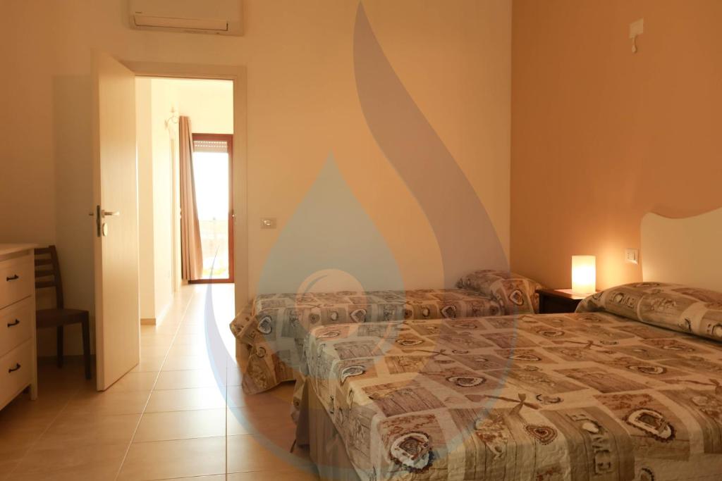 A bed or beds in a room at Acqua e Sale Avola