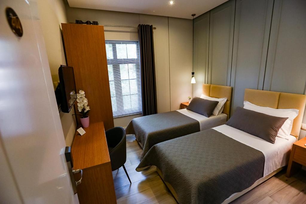 Postel nebo postele na pokoji v ubytování Home Hotel