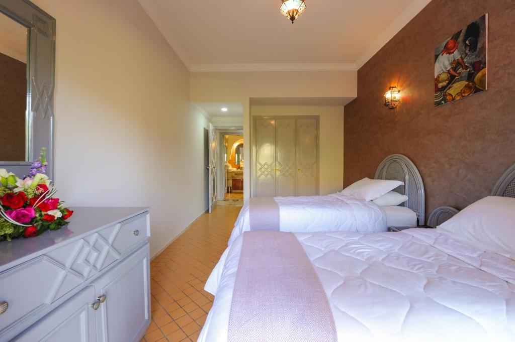 Postel nebo postele na pokoji v ubytování In Club Palmeraie Resorts