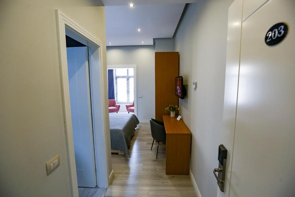 Postel nebo postele na pokoji v ubytování Home Hotel