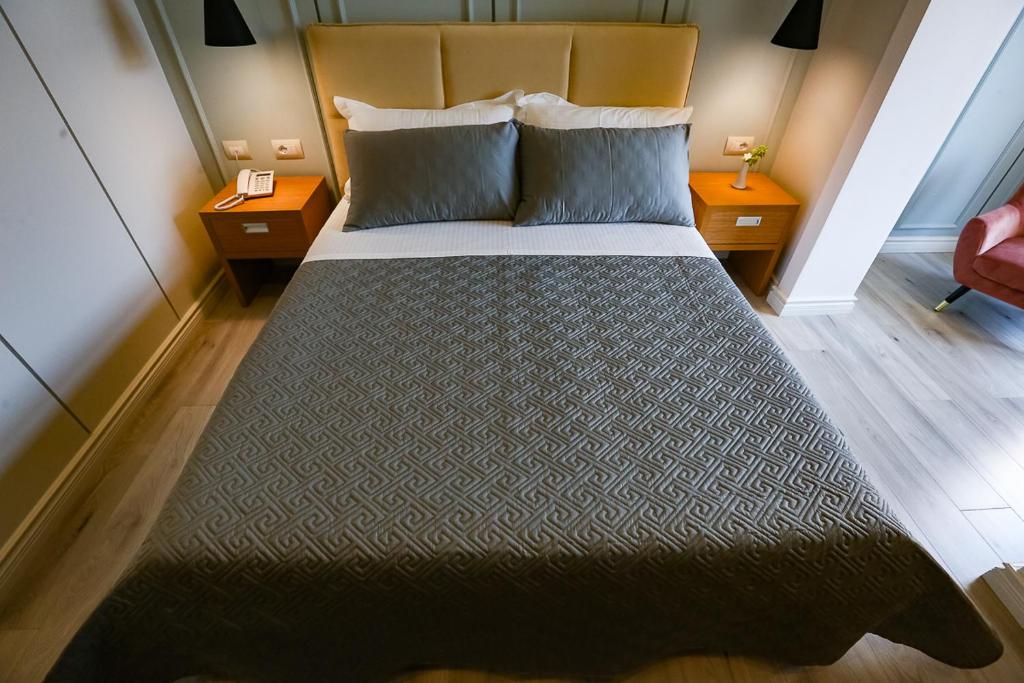 Postel nebo postele na pokoji v ubytování Home Hotel
