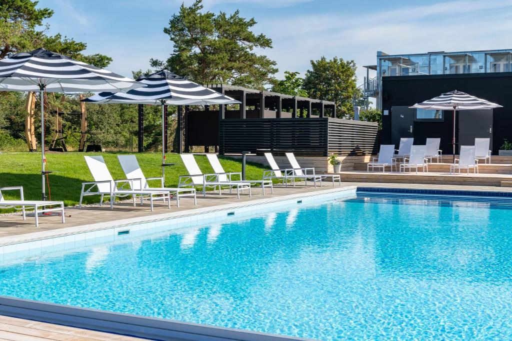 Bazén v ubytování First Hotel Kokoloko nebo v jeho okolí