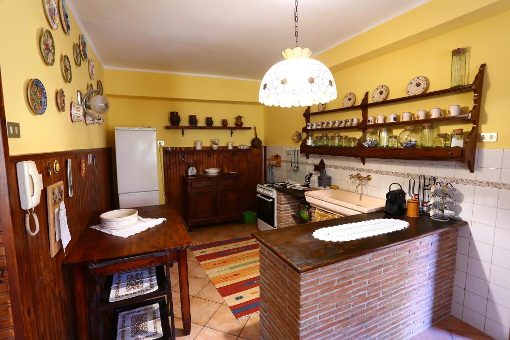Kuchyň nebo kuchyňský kout v ubytování Residenza La Dimora ImPerfetta