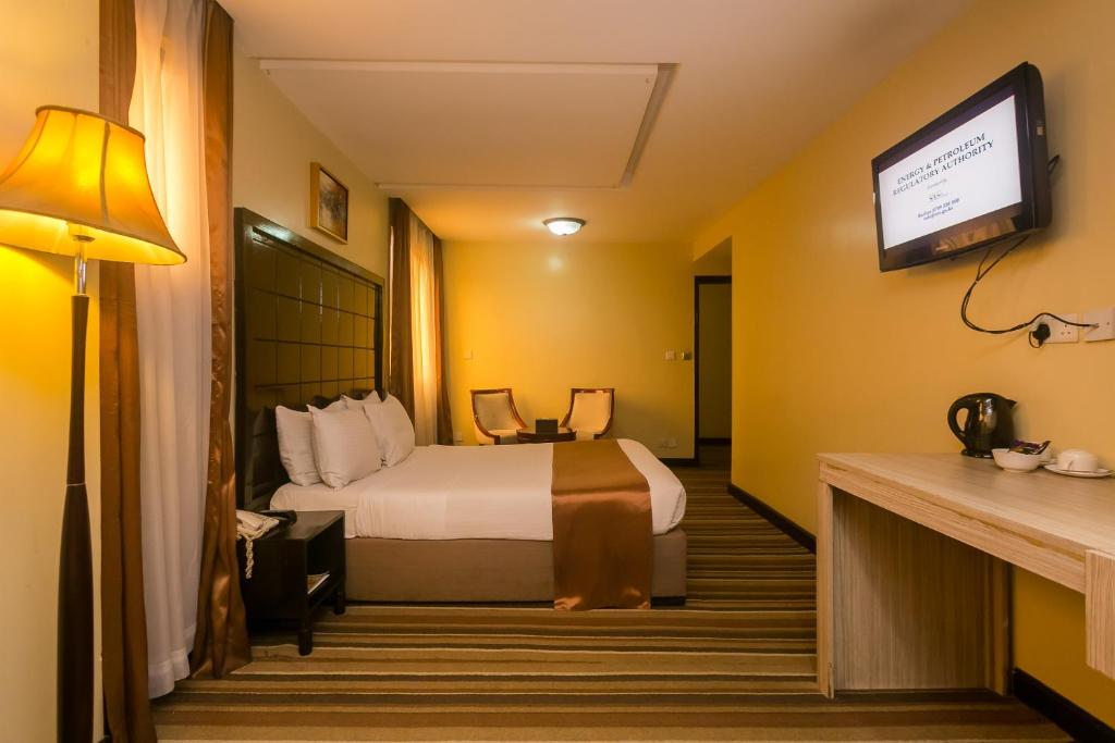 Postel nebo postele na pokoji v ubytování The Clarion Hotel