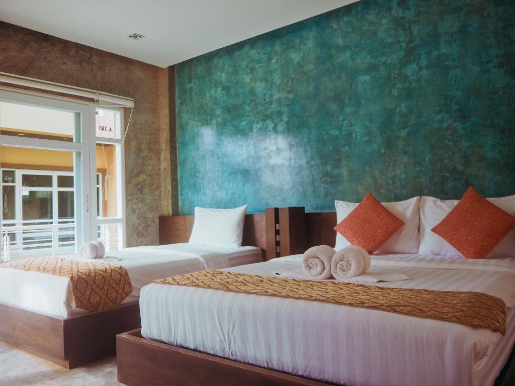 Postel nebo postele na pokoji v ubytování Silver Sands Resort - Koh Tao
