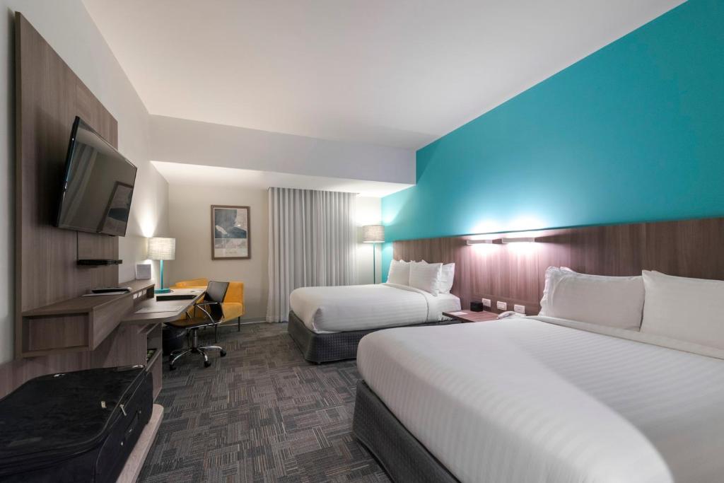 Postel nebo postele na pokoji v ubytování Holiday Inn - Lima Airport by IHG