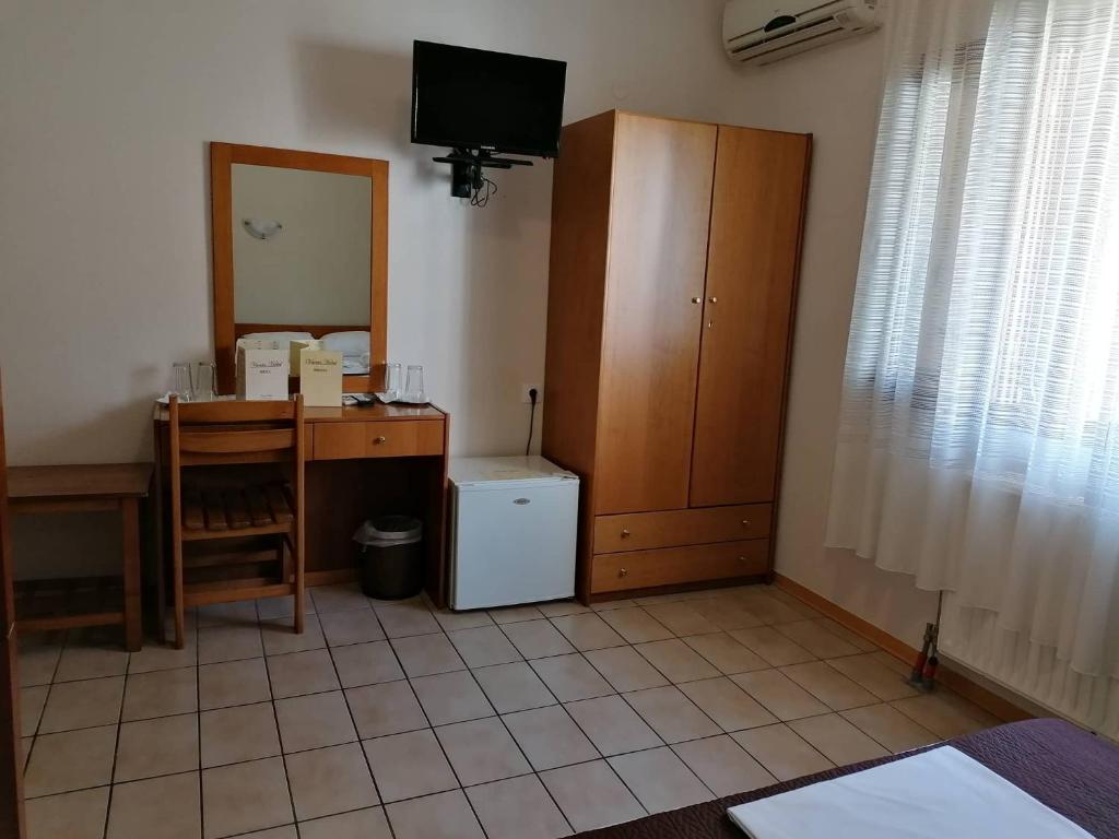 TV a/nebo společenská místnost v ubytování Vanta Hotel