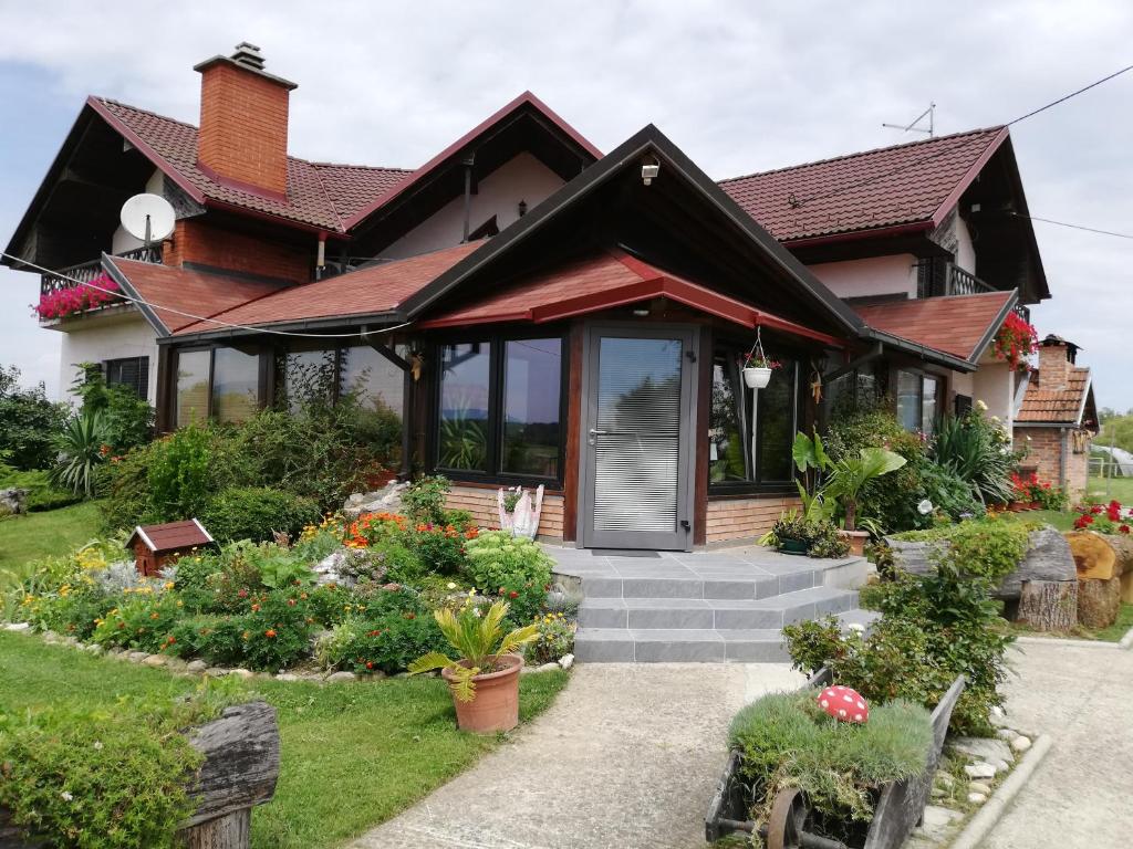 a house with a front door and some flowers at T.S.G. Šimanović in Klinča Sela