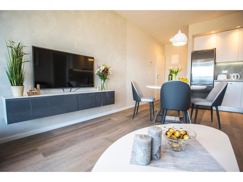 TV a/nebo společenská místnost v ubytování Uma Apartment