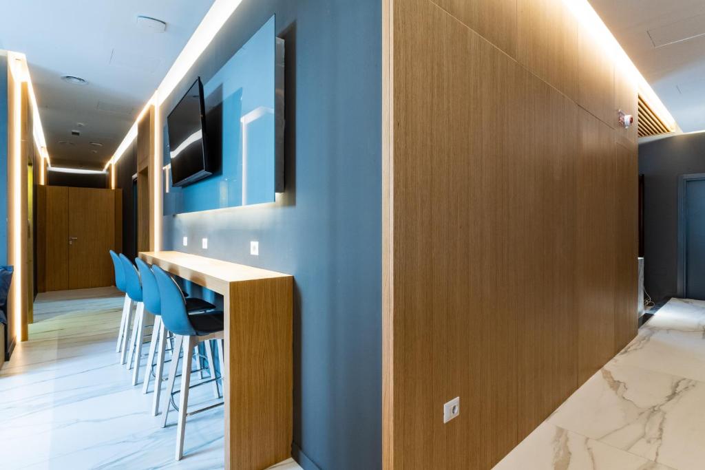 TV a/nebo společenská místnost v ubytování Concept Terrace Hotel