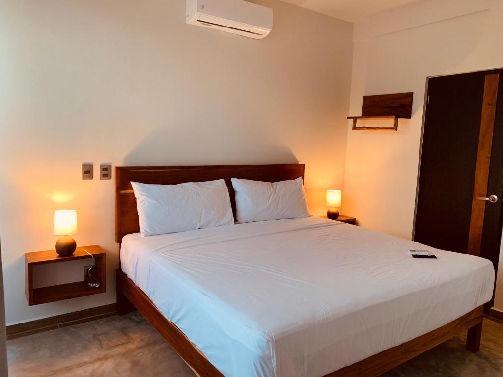 Postel nebo postele na pokoji v ubytování Hotel Muyu Tulum