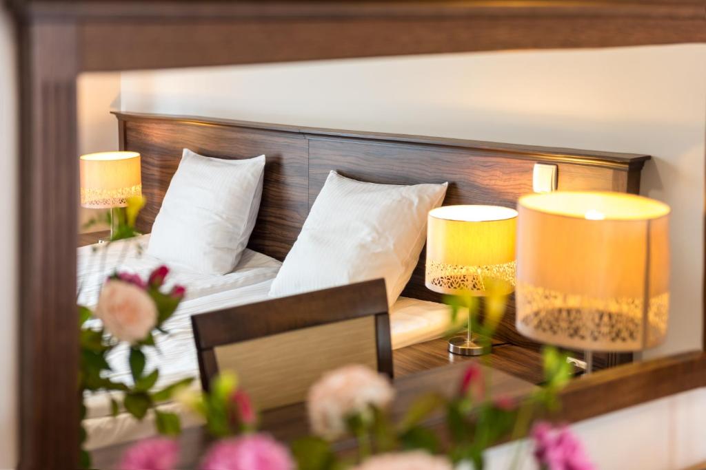 Łóżko lub łóżka w pokoju w obiekcie AirPark Balice