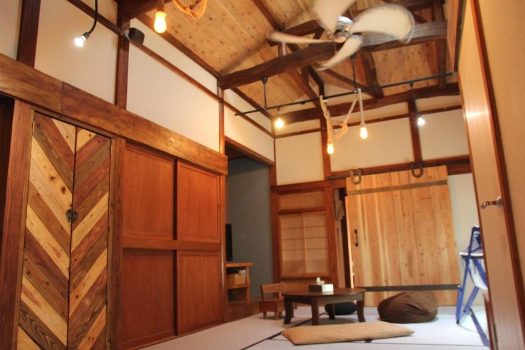 a room with a barn door and a table at Isumi-gun - Cottage / Vacation STAY 38211 in Iwada