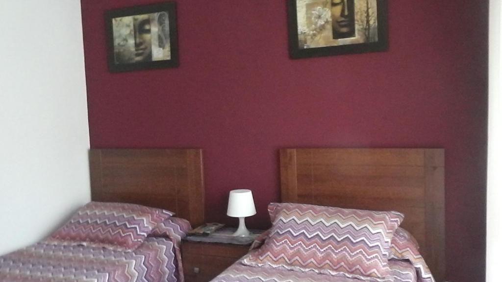 Postel nebo postele na pokoji v ubytování Pensión Vegadeo Gijón