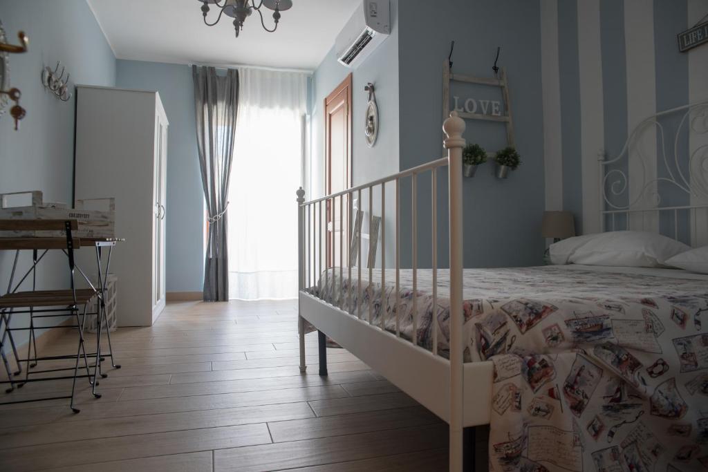 Postel nebo postele na pokoji v ubytování Hercules House - Il riposo degli Eroi