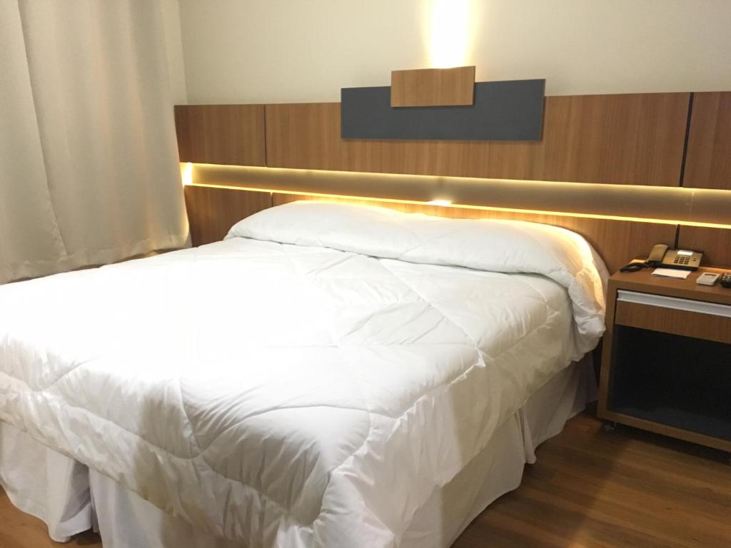 Postel nebo postele na pokoji v ubytování Hotel Aero Park e Estacionamento