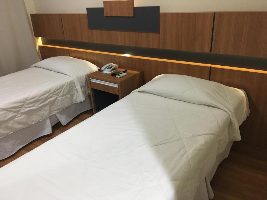 Postel nebo postele na pokoji v ubytování Hotel Aero Park e Estacionamento