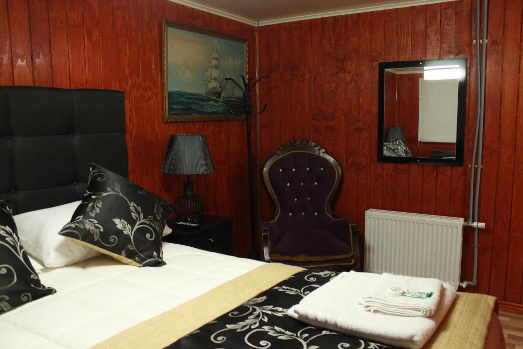 Postel nebo postele na pokoji v ubytování Hotel Forjadores del Cabo de Hornos